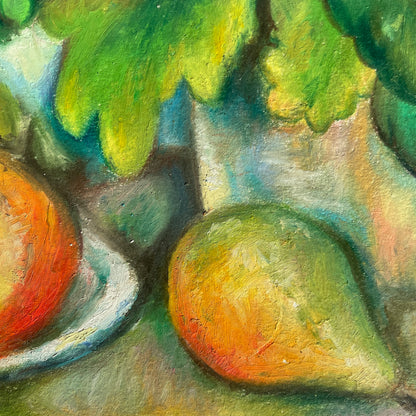Close-up of a pear in a still life painting with fruits and leaves