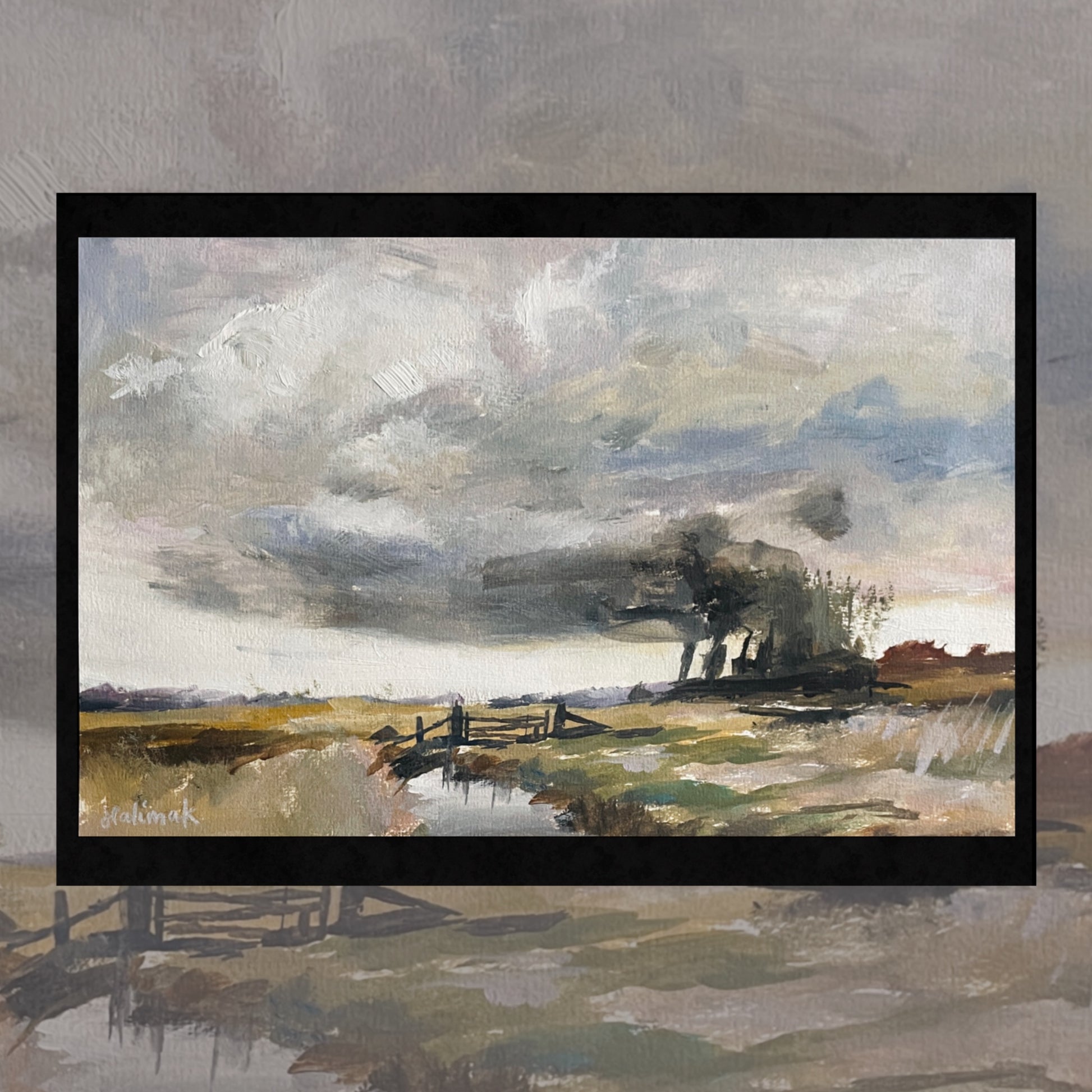 Framed painting of a landscape with a cloudy sky and fields by emerging artist halima khanum after british artist seago
