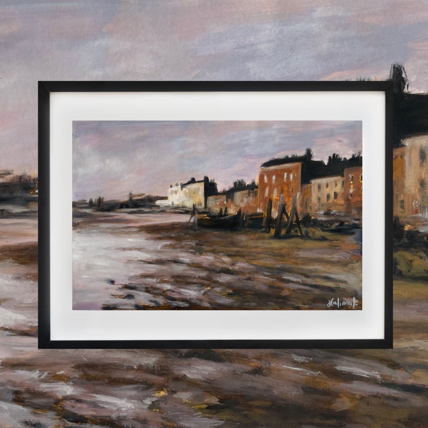Framed painting of a coastal scene with buildings and boats.