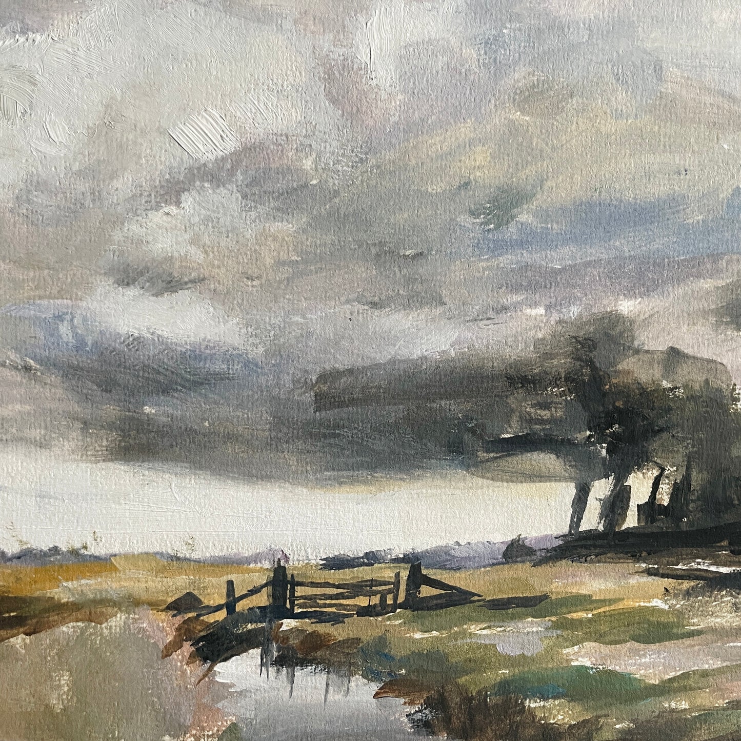 erthy toned crop of a landscape gate featuring bridge, still water and moody skies