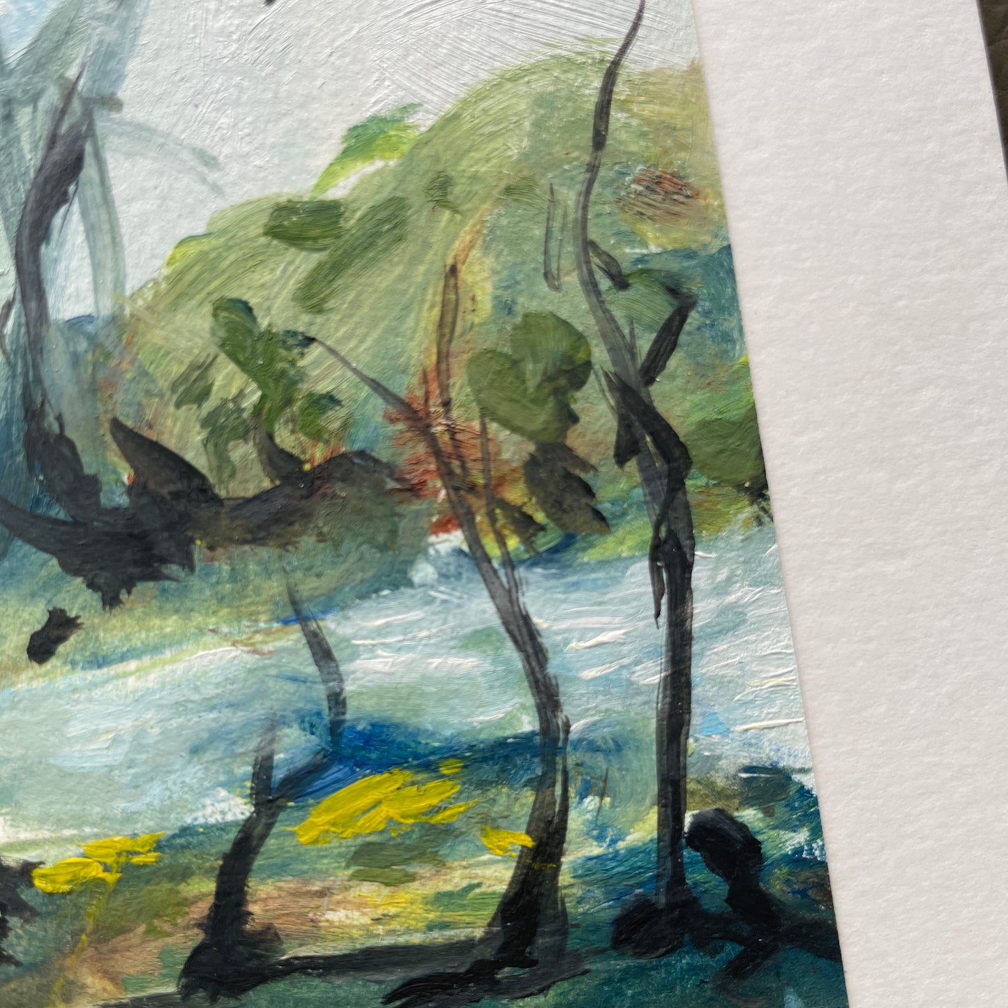 Artistic depiction of nature with trees, branches, and a body of water. texture of watercolour paper and brustrokes visible. 