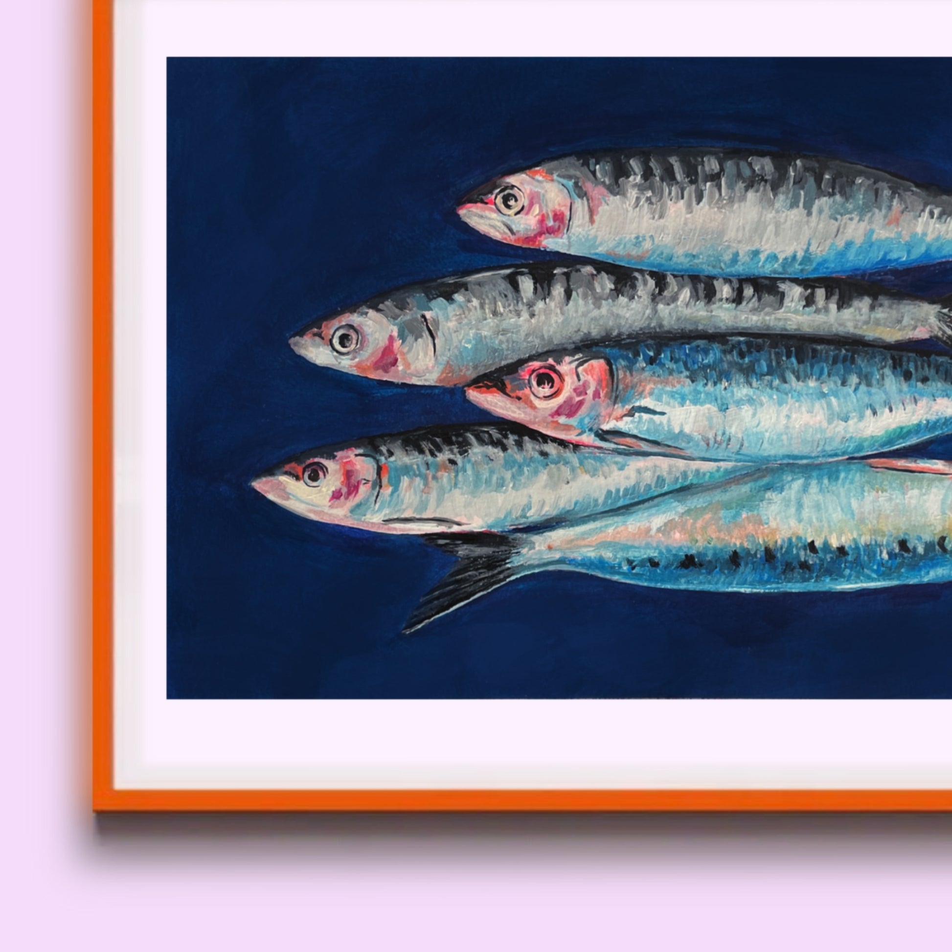 Framed artwork of four fish on a blue background with orange frame