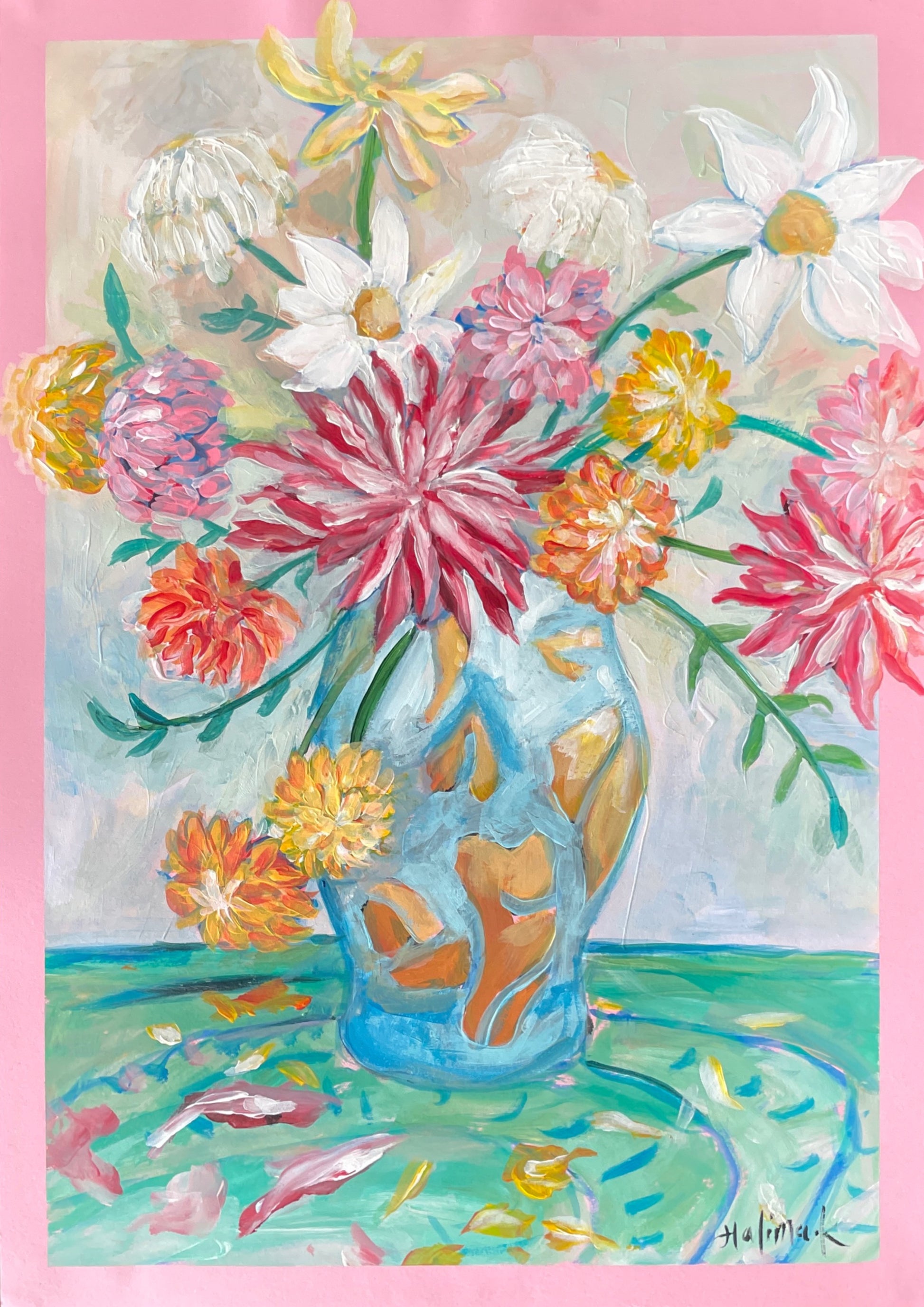 Colorful floral arrangement in a blue vase on a pink background with turquoise surface