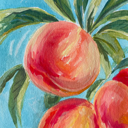 Artistic depiction of peaches with green leaves on a blue background. Vibrant depiction of peaches by Halima Khanum london artist