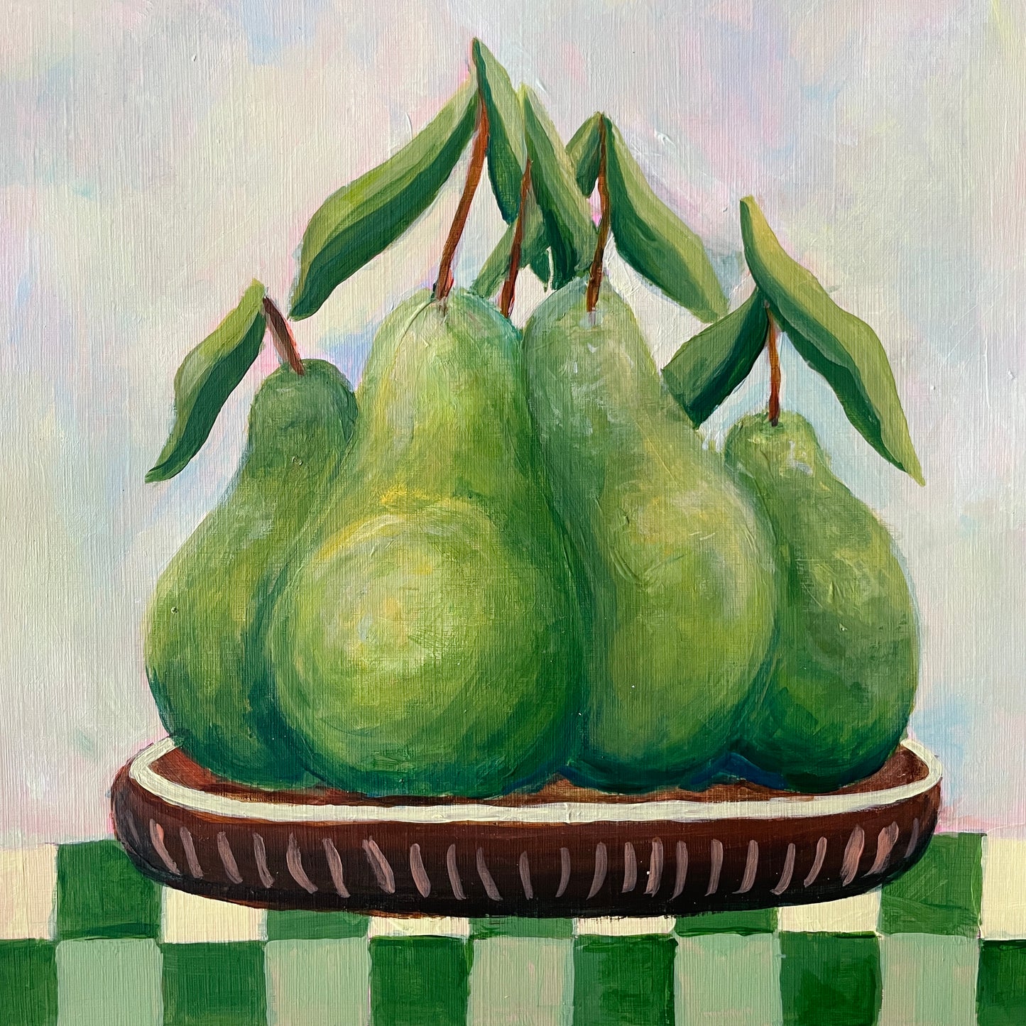 original acrylic food painting of green pear fruits on a wooden plate with a checkered tablecloth.