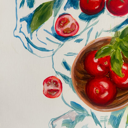 close up of the bowl and some sliced tomatoes from halima khanum's tomatoes with blue acrylic painting part of her early works on paper as an amerging artist. 