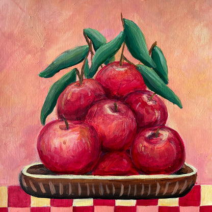 Painting of red apples on a checkered tablecloth with a pinkish background