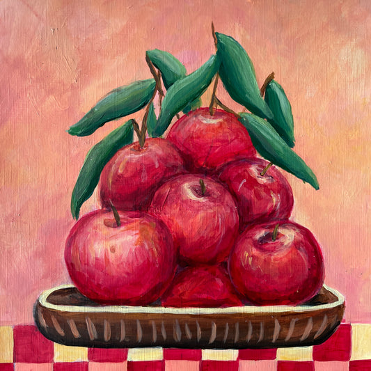 Painting of red apples on a checkered tablecloth with a pinkish background