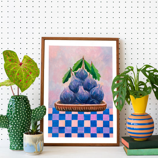 Framed artwork of purple fruits on a checkered background, surrounded by decorative plants and vases.
